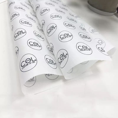 Un buen precio. Papel de embalaje de tejido personalizado con ramo impreso para embalaje de regalo de ropa en línea