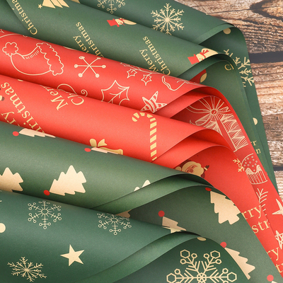 Un buen precio. Papel de embalaje impermeable con tema navideño para ramos de rosas o arreglos florales en línea