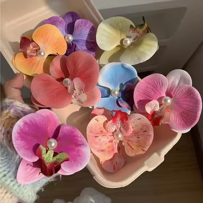Un buen precio. Venta caliente de horquillas artificiales de flores de orquídeas de pelo de flores clip de pelo de playa de vacaciones accesorios de pelo en línea