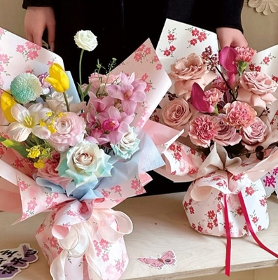 Un buen precio. Papel de embalaje de flores de primavera, papel de embalaje de ramos de flores frescos espeso, papel de embalaje impreso impermeable, embalaje de floristería de arte floral en línea