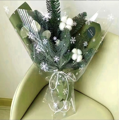 Un buen precio. Tienda de flores de celofán de copo de nieve impermeable de Navidad, ramos de flores de Nochebuena, regalos, fábrica de envases de manzanas mayorista y venta directa en línea