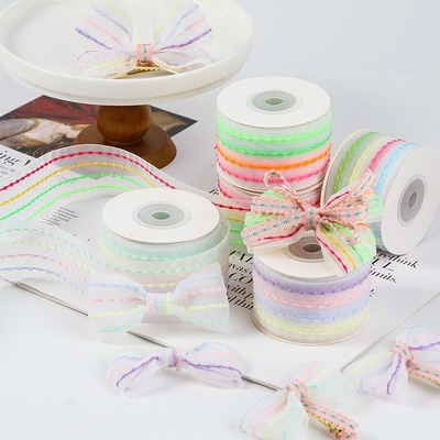 Un buen precio. Cuatro colores de burbuja rayada transparente de gasa cinta de cabello accesorio de bricolaje material de arco ramo cinta de embalaje en línea
