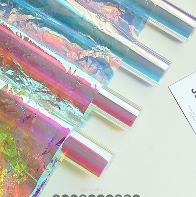 Papel de envoltura de flores de película de colores, papel perolado, arco iris láser, papel de caramelo transparente de siete colores, material de envoltura de flores de colores
