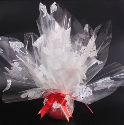Un buen precio. Papel de envoltura de frutas de Navidad, embalaje de flores, celofán transparente, papel de envoltura de regalo en forma de corazón inglés 70 # en línea
