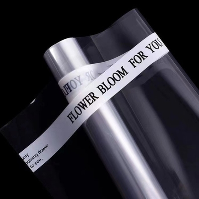 Un buen precio. Papel de regalo al por mayor, celofán transparente, material de embalaje impermeable para revestimientos florales, papel de regalo de ramo en línea